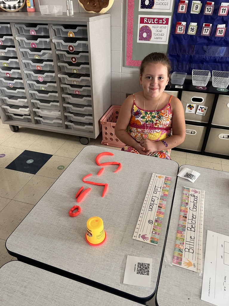 student with Play-doh numbers