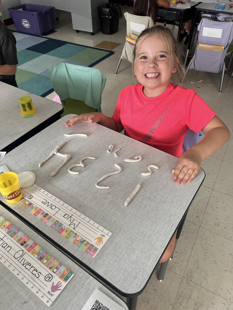 student with Play-doh numbers