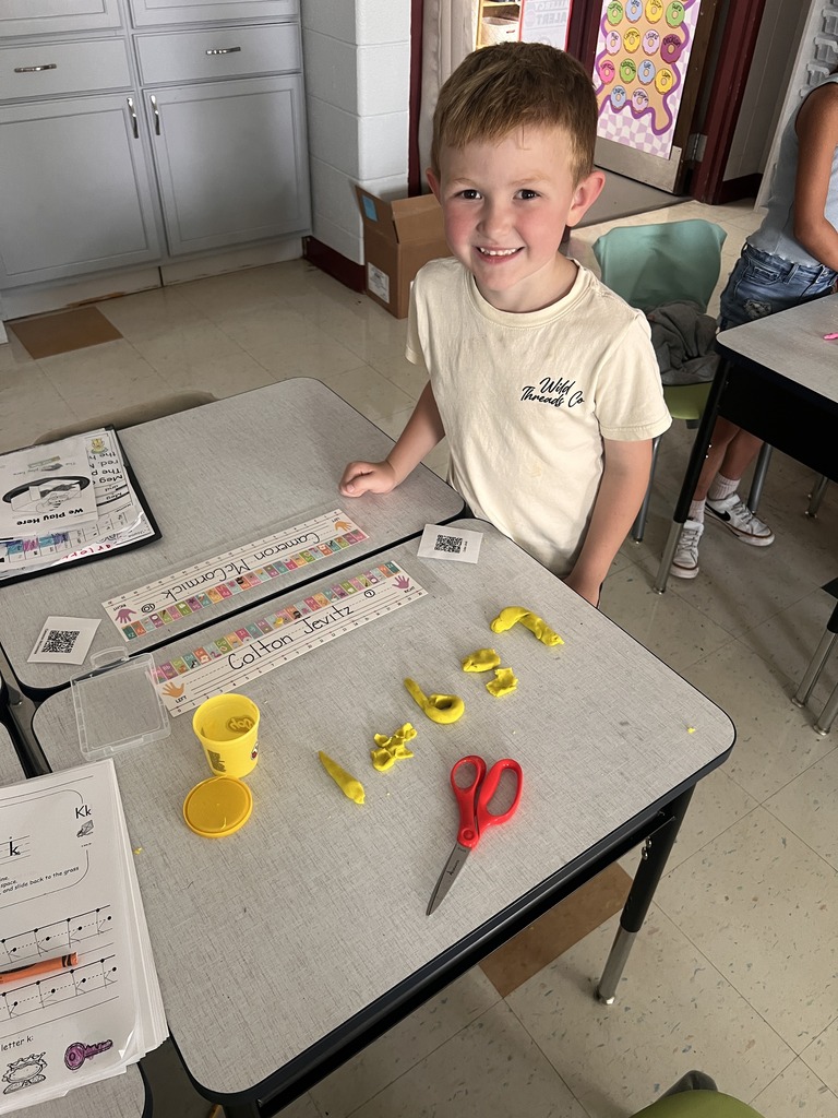student with Play-doh numbers