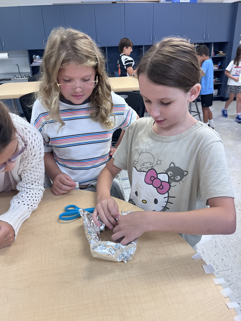 students building boats