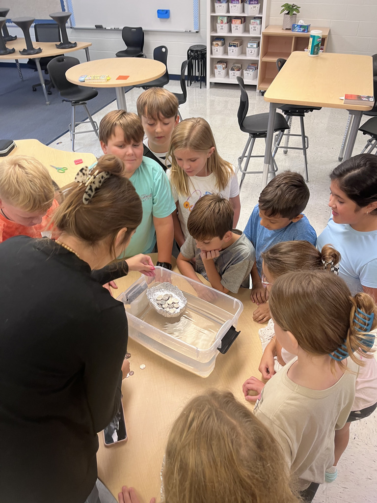 students testing boats