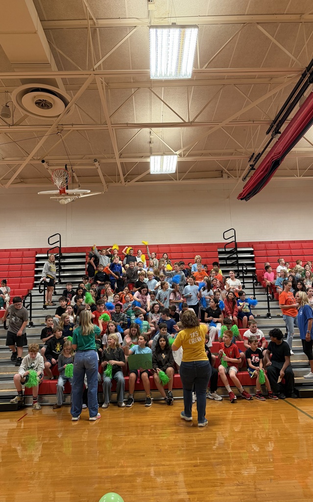 Students cheering in the bleachers
