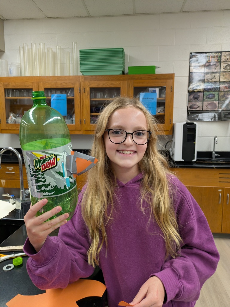 Student with soda bottle