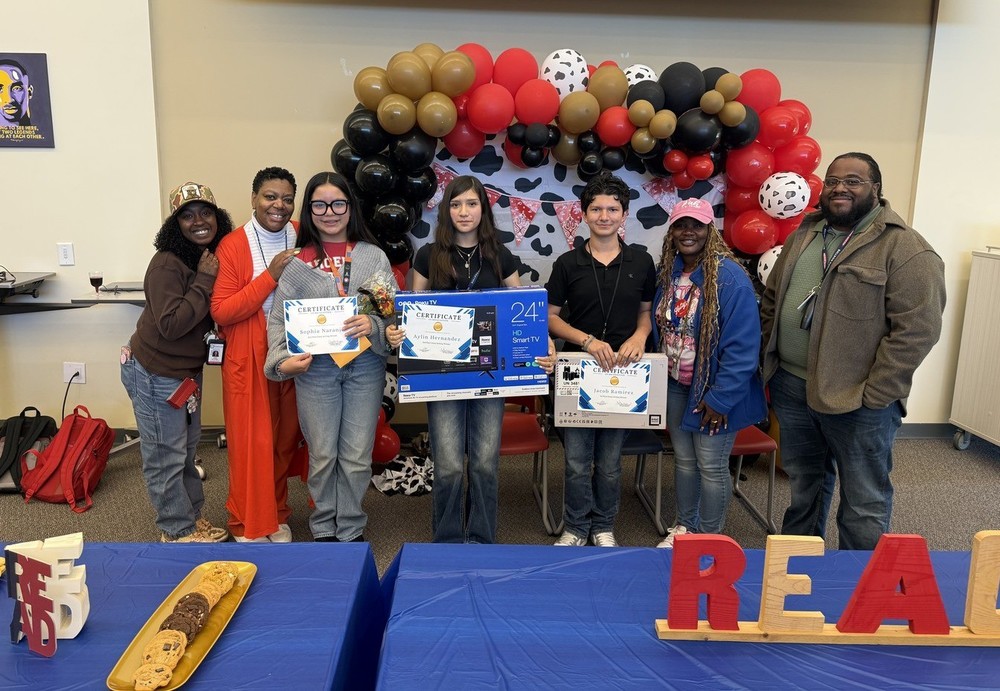 students and teachers posing with their awards
