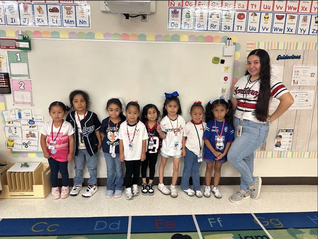 Students and teacher wearing sports jerseys for Hispanic Heritage