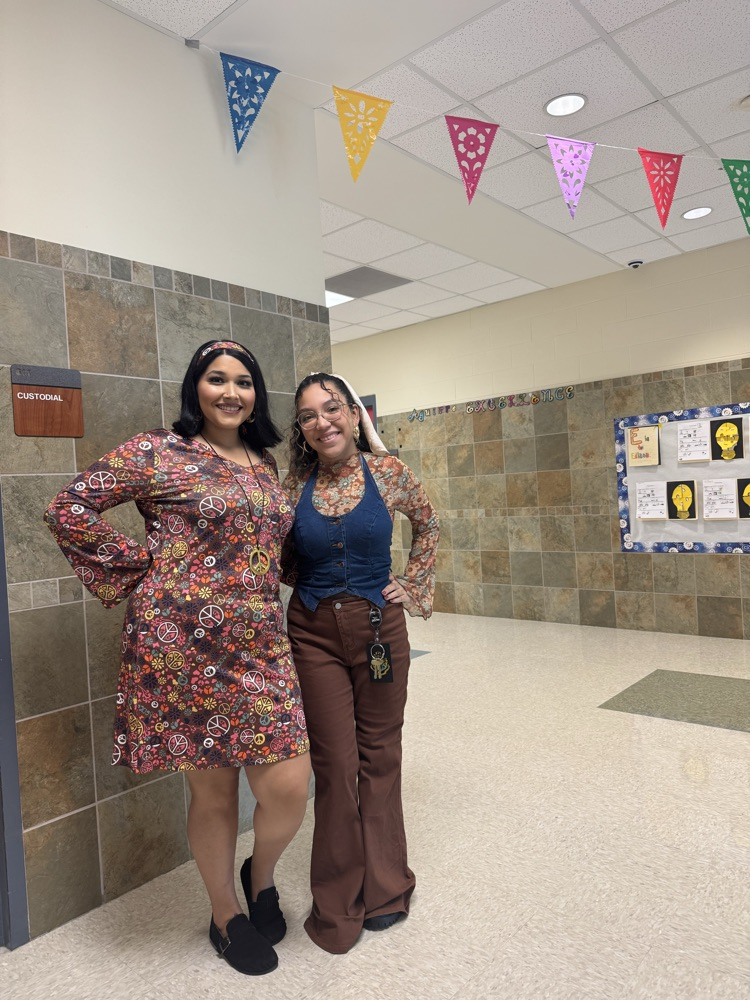 staff dressed in 70s attire