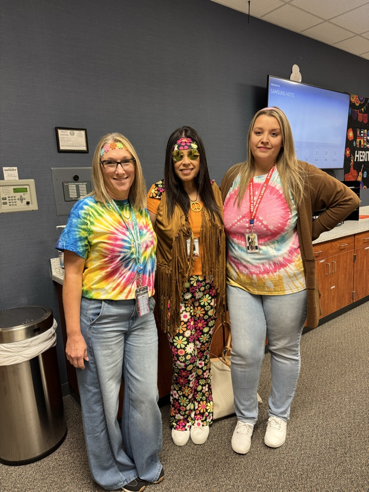 staff dressed in 70s attire