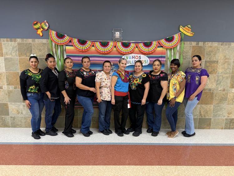 staff in traditional wear