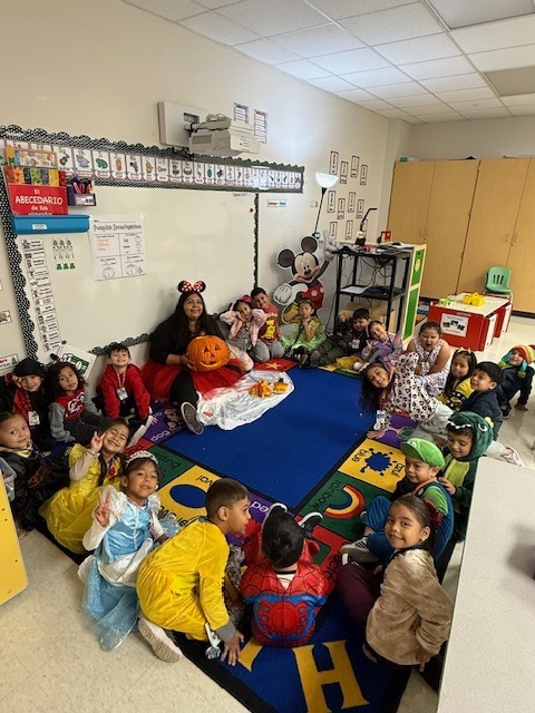 Teachers and students carving pumpkin