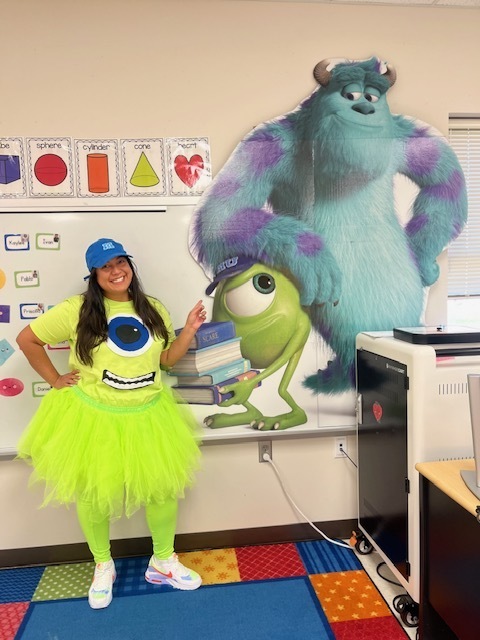 Teacher dressed up as character from Monsters, Inc.