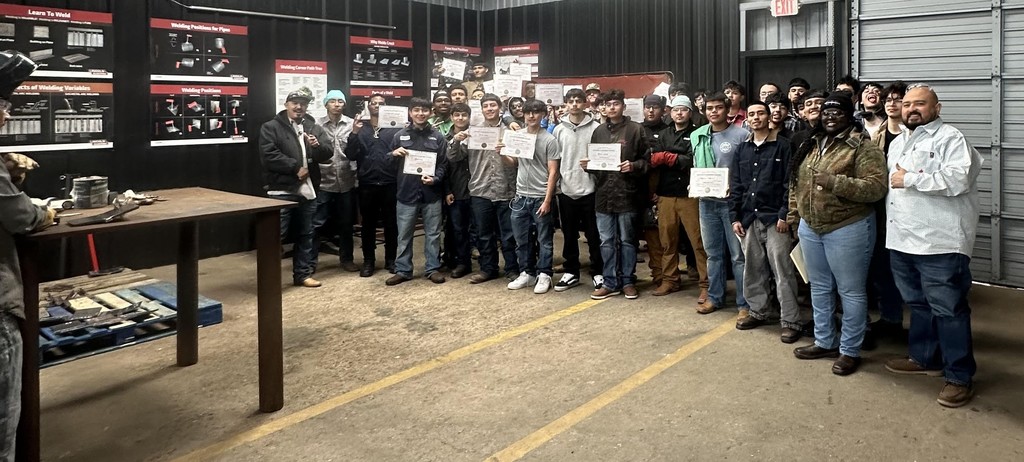 group of welding students and teacher