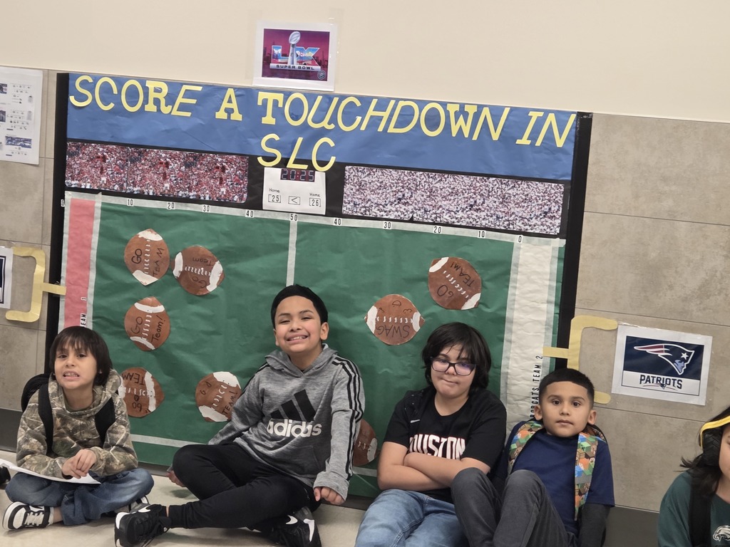Students posing for picture after superbowl party