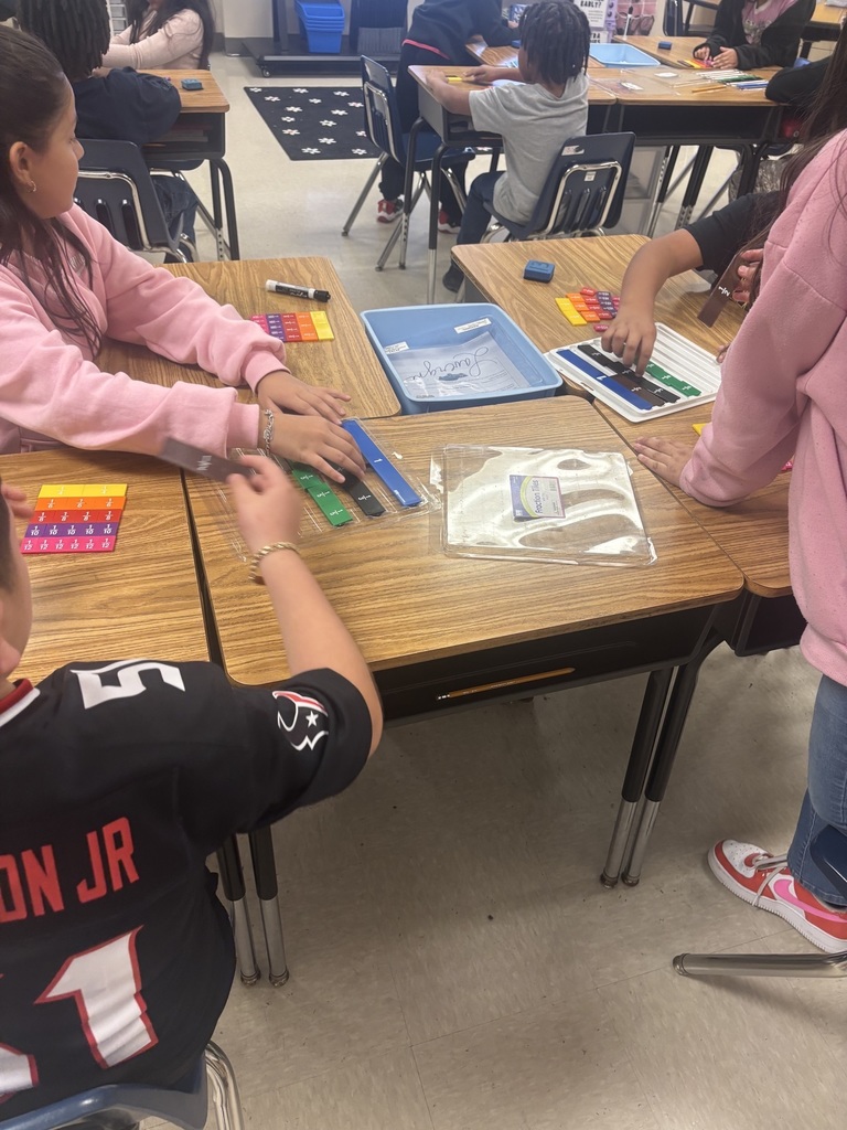 Students using fraction tiles