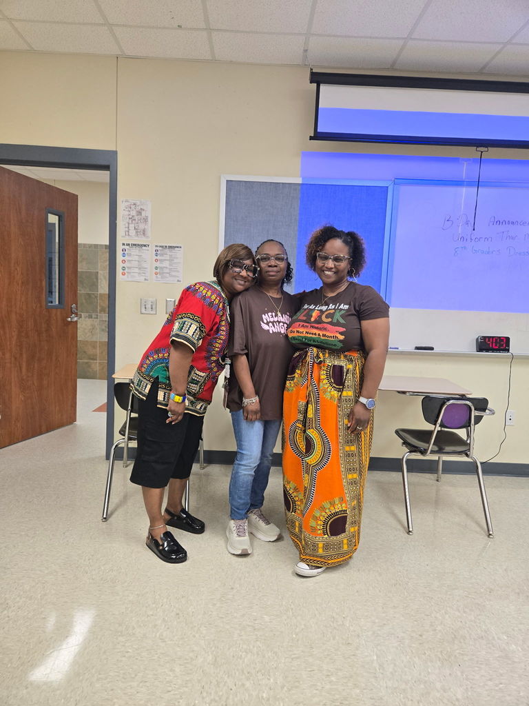 Librarian, staff SSG andrus and SGT Brown dressed up for melanin monday