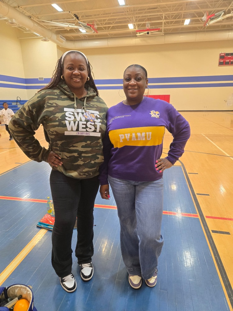 coach Johnson and ms. Powell dressed in college wear