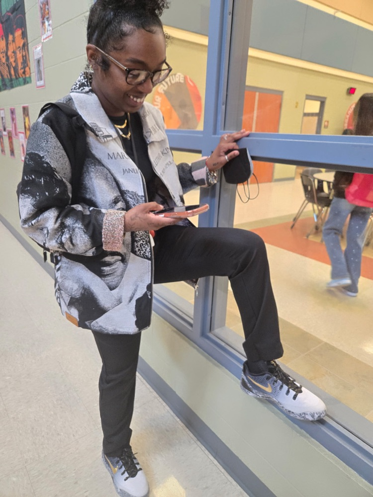 coach Mitchell showing off her creative shoes