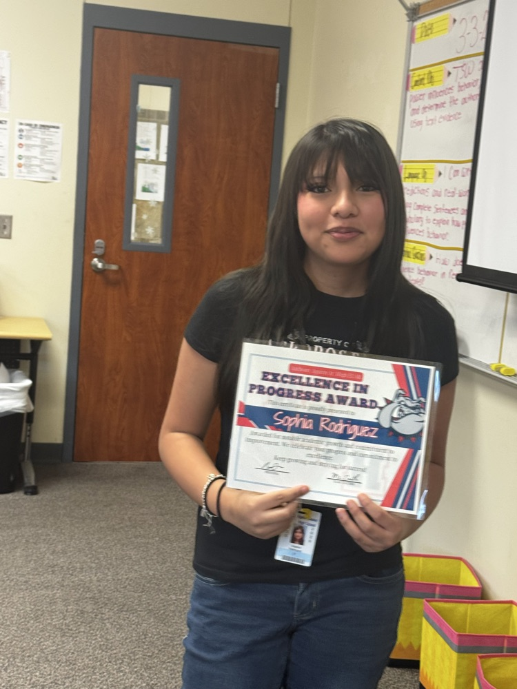 student receiving excellence in progress award in ms. smiths class