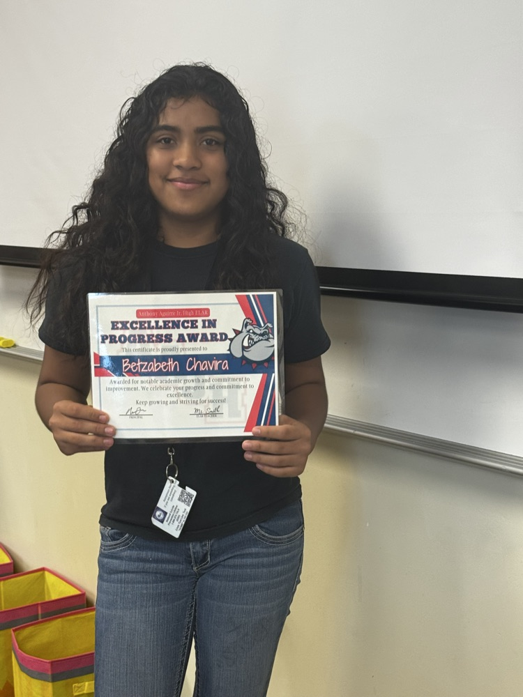 student receiving excellence in progress award in ms. smiths class