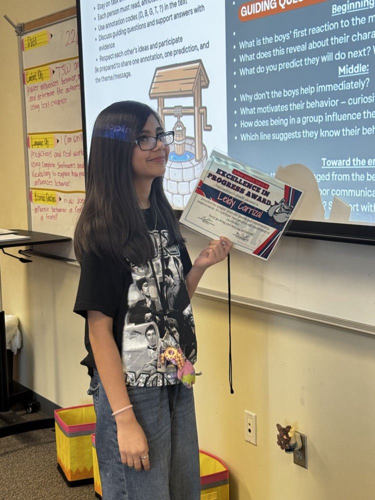 student receiving excellence in progress award in ms. smiths class