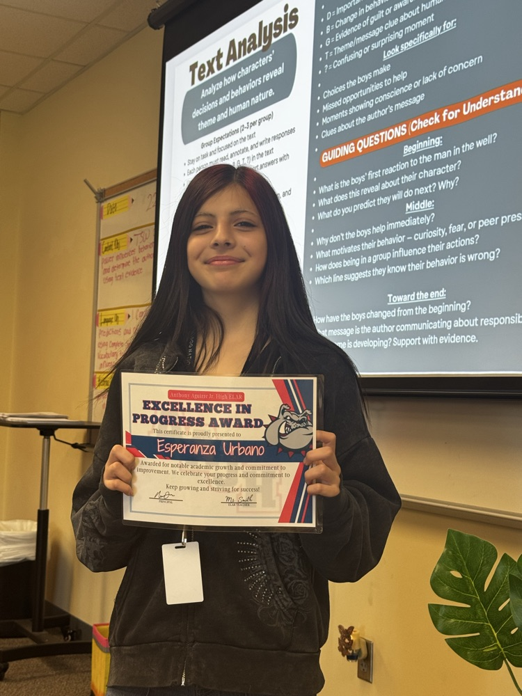 student receiving excellence in progress award in ms. smiths class