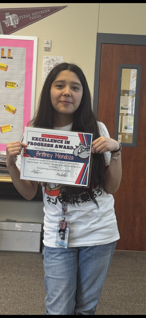 student receiving excellence in progress award in ms. smiths class
