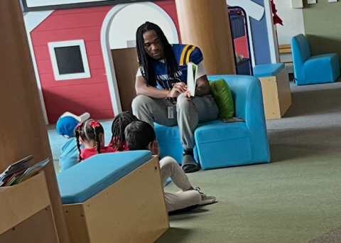 Channelview HS Football Players reading to ECC Pre-K Students for Dr. Seuss Week