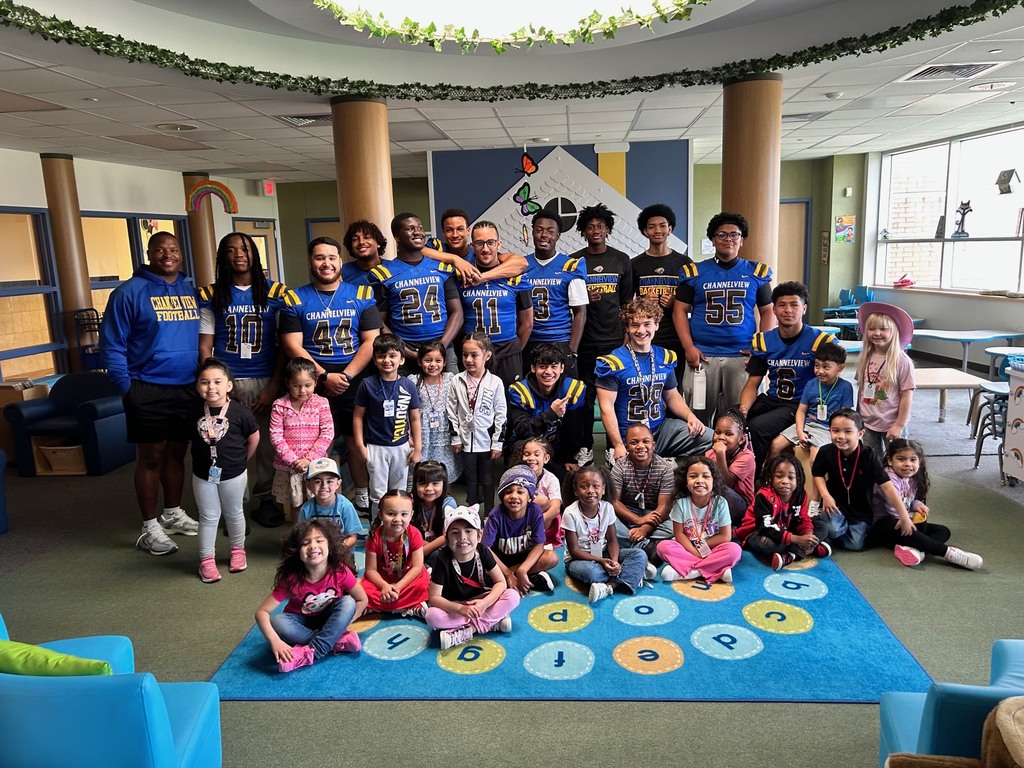 Channelview HS Football Players reading to ECC Pre-K Students for Dr. Seuss Week