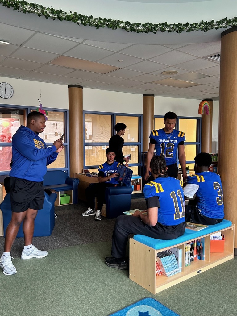 Channelview HS Football Players reading to ECC Pre-K Students for Dr. Seuss Week