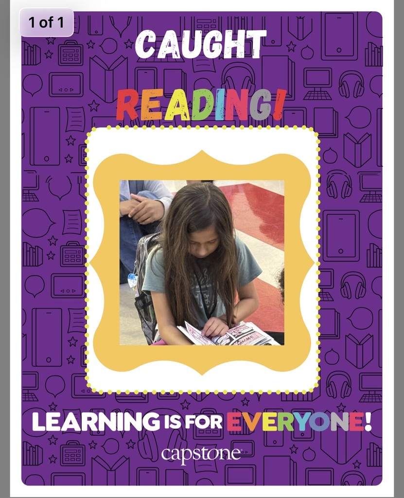 Caught reading picture of student read across America week