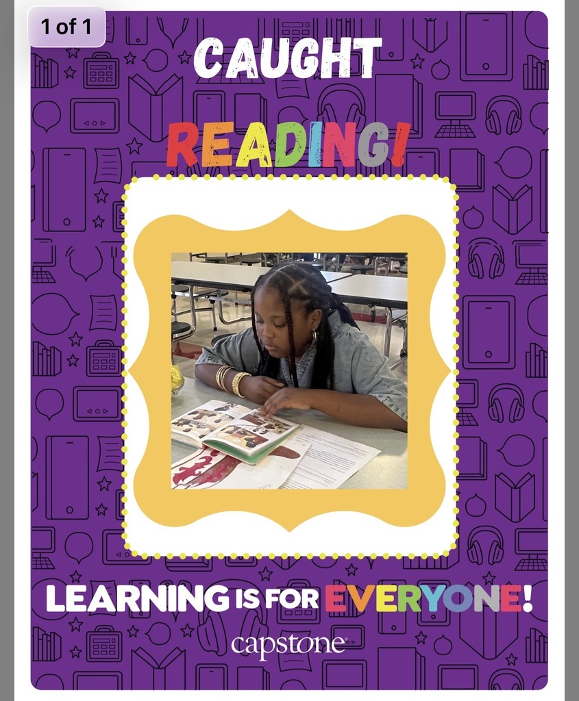 Caught reading picture of student read across America week