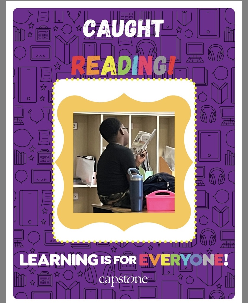 Caught reading picture of student read across America week
