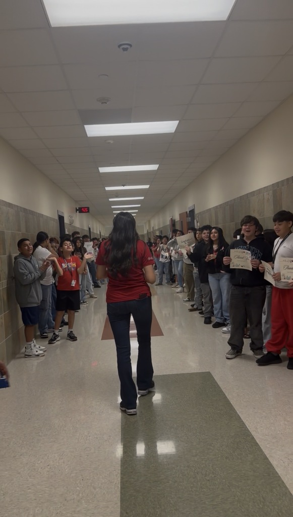ms. vaca walking down the hallway