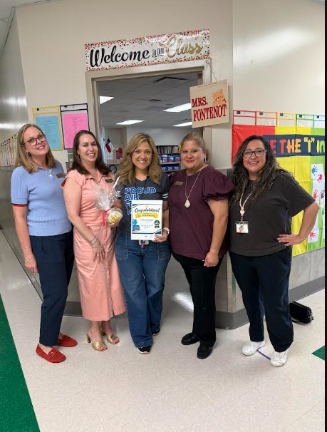 Teacher receiving treat for passing ELA test