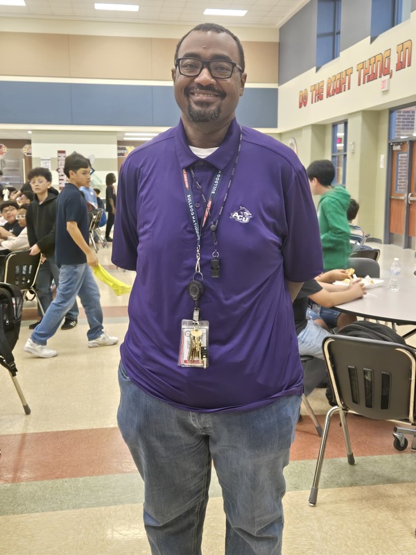 Mr. Cunningham wearing a purple shirt for Purple Up Day
