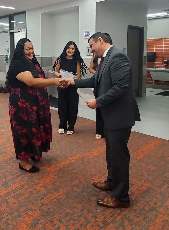 Mr. Lopez handing out certificates