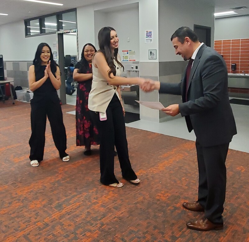 Mr. Lopez handing out certificates