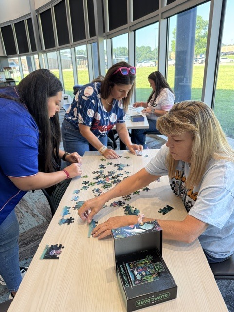 ladies working a puzzle