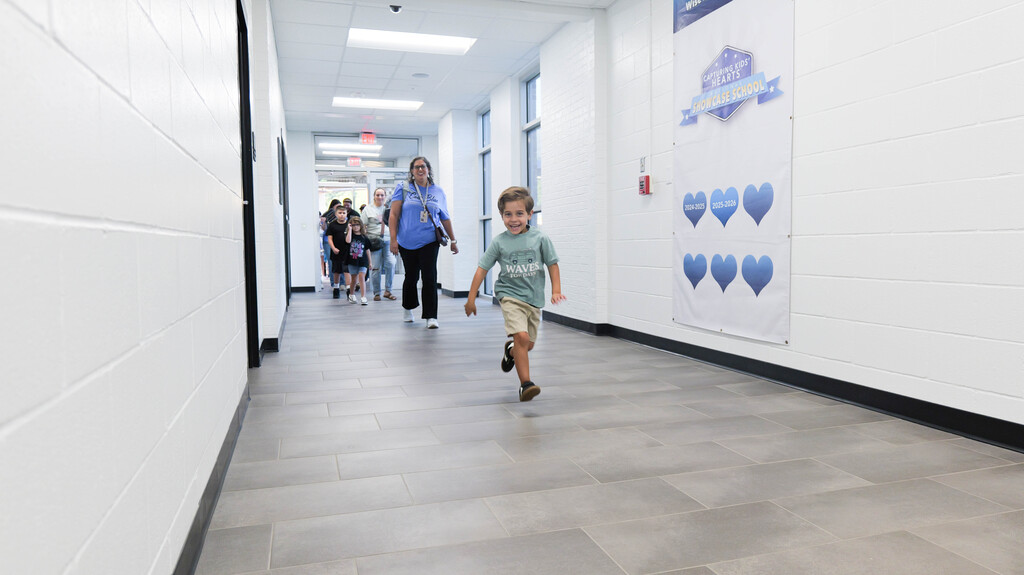 a kid running down the hallway
