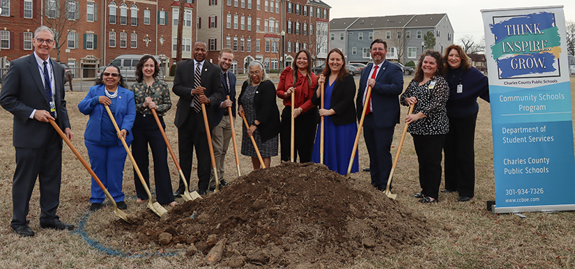 group of people with shovels at a grand opening