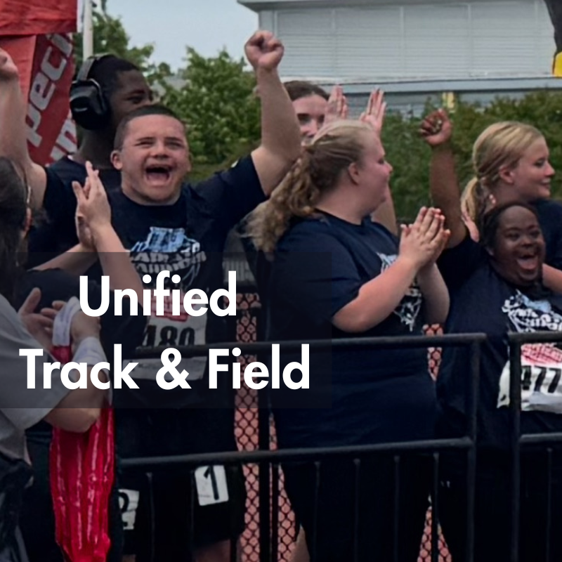 students cheering from track side