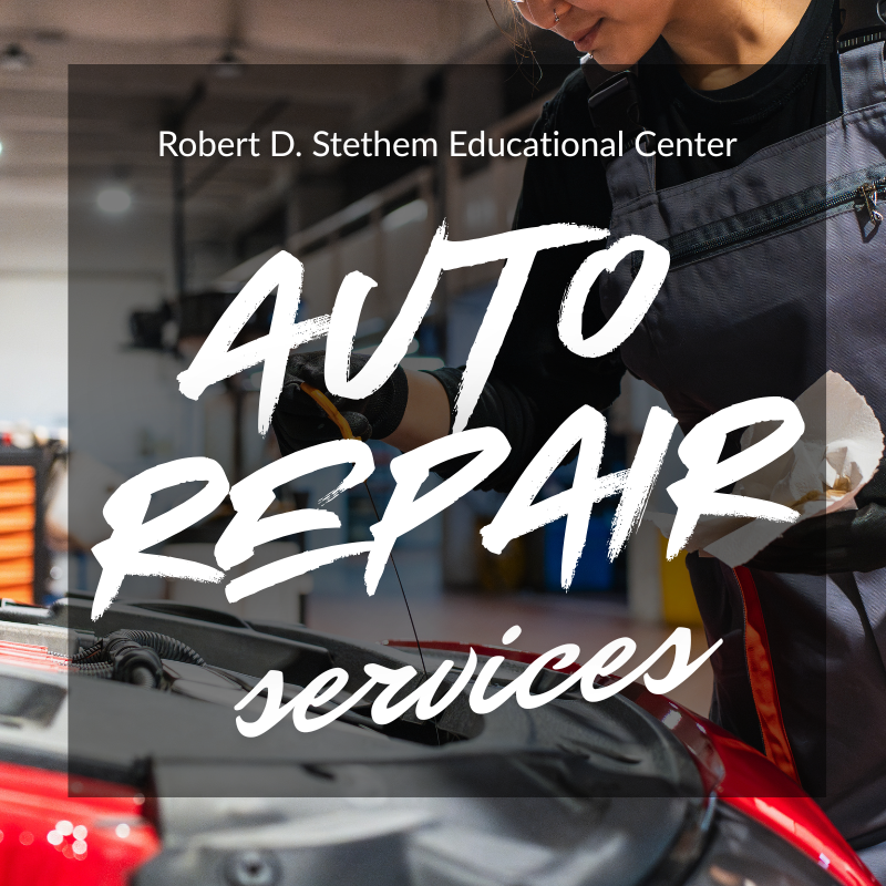 student completing auto repairs