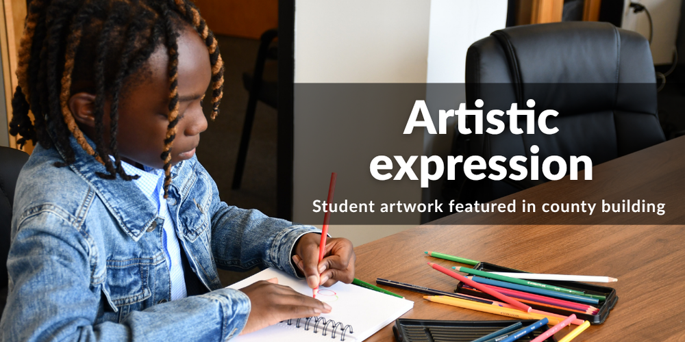 Student drawing with colored pencils