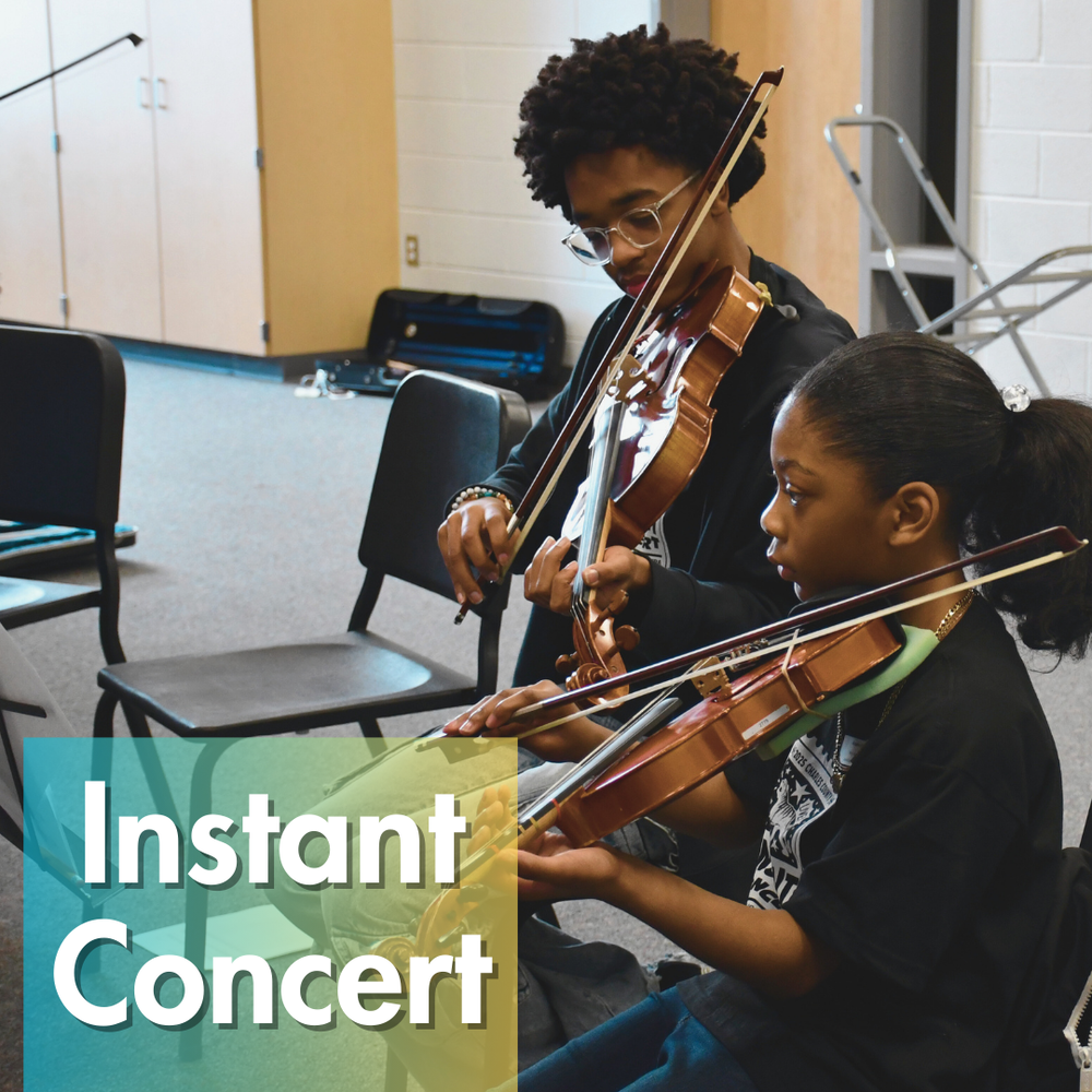 two students playing violins