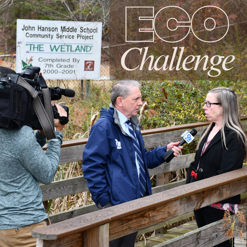 woman being interviewed by man with microphone and man with camera