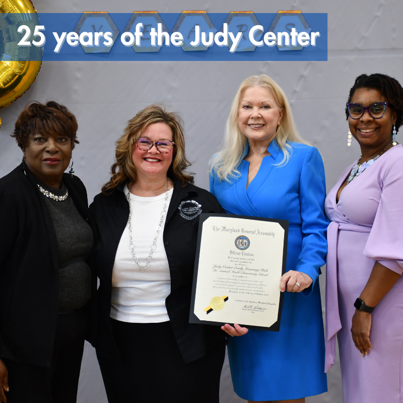 four women holding a certificate
