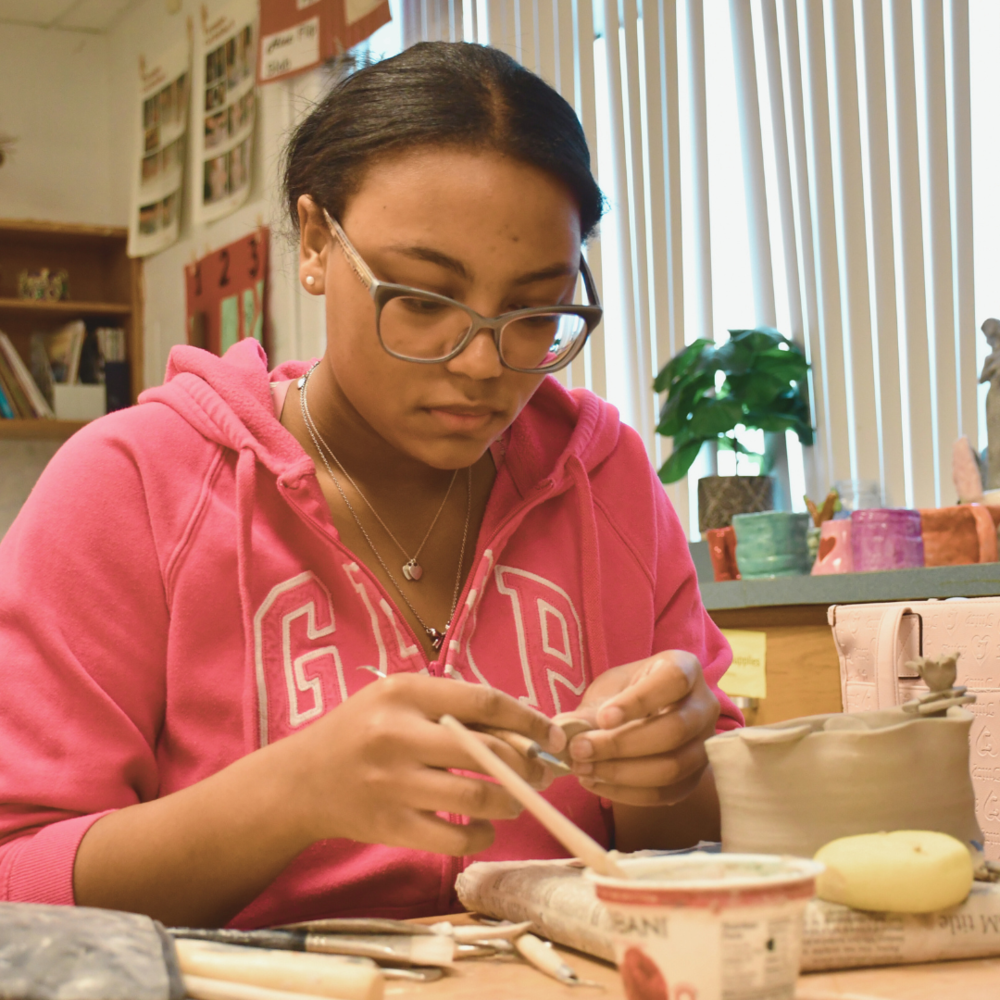 senior student working on art piece