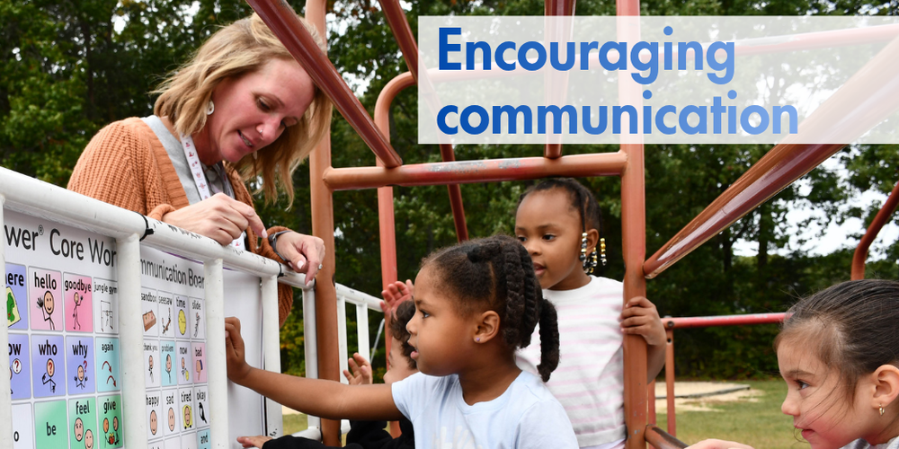 Students and a staff member on a playground