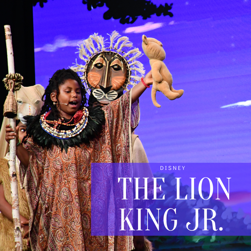 three students on stage performing the lion king
