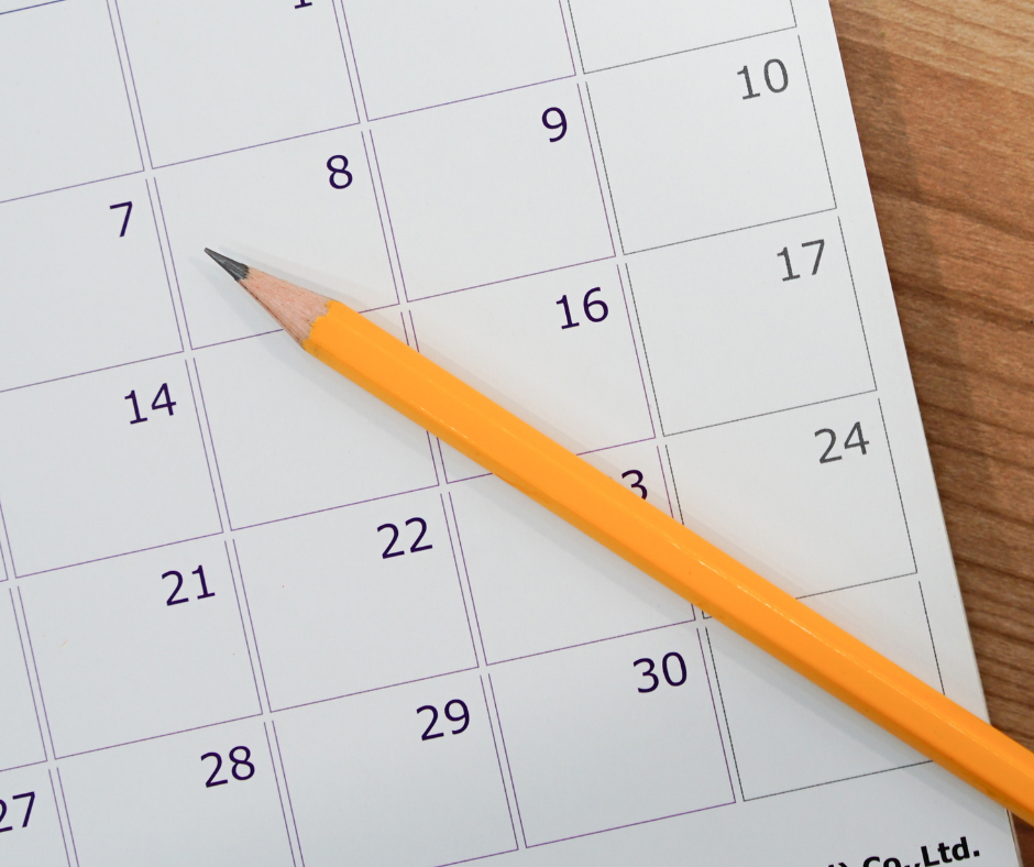 calendar with a pencil on top