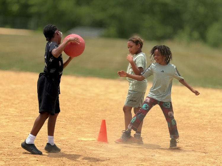 child playing kickball